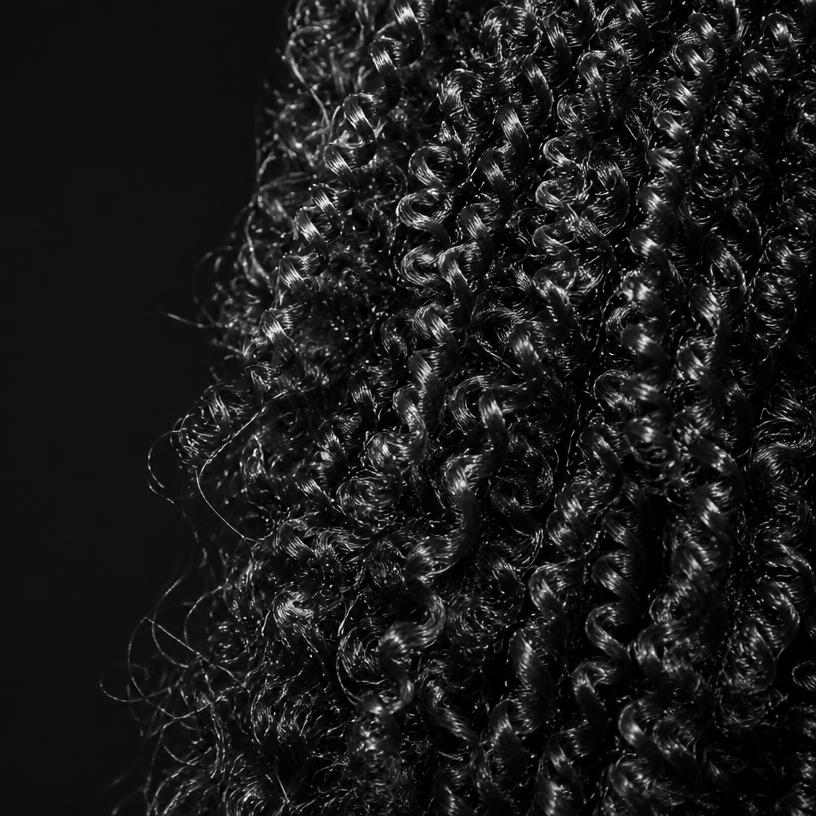 Macro studio photograph of type 3C hair texture